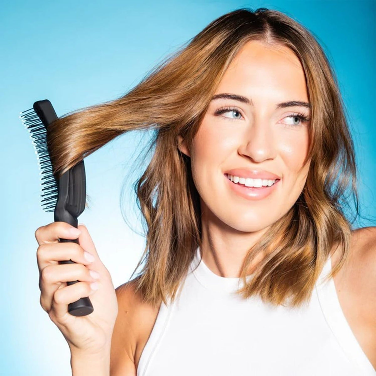 GIMME Beauty Vented Detangling Brush vented design promotes quicker blow-drying.