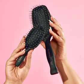 GIMME black travel brush ideal for quick detangling and everyday use.