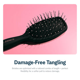 GIMME compact hair brush designed for knot-free brushing on-the-go.