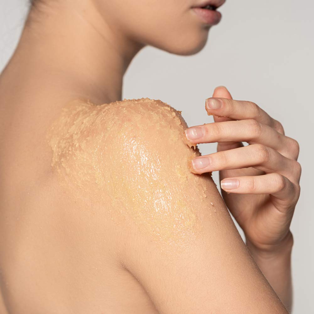 Ginger Lily Farms Botanicals Organic Sugar Scrub hands applying for body treatment.