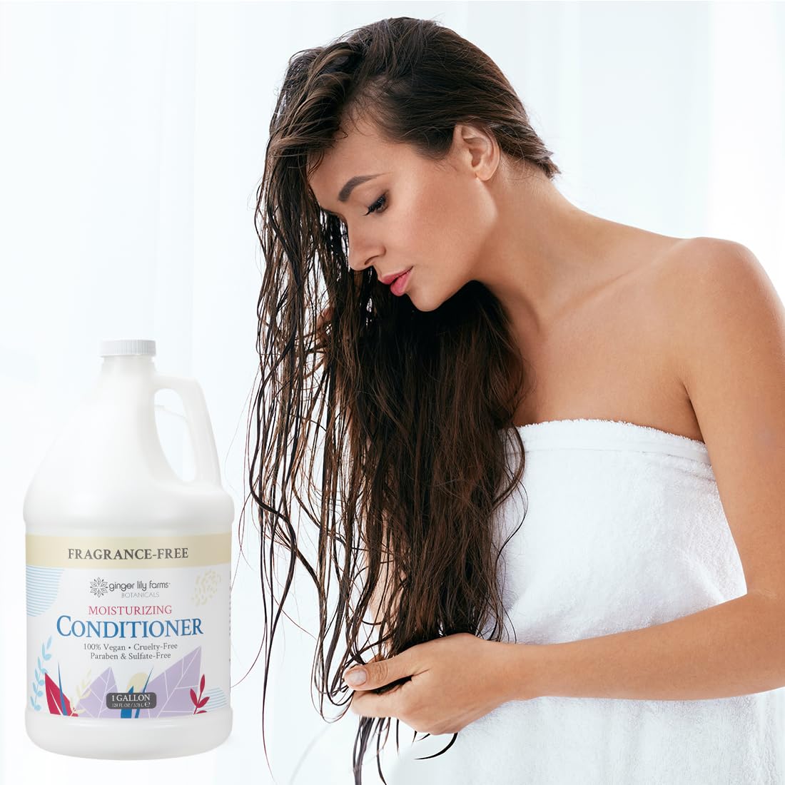 In-shower scene with conditioner being applied to damp hair for smooth results