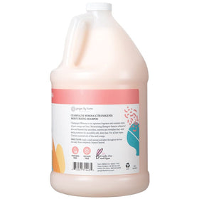 Ginger Lily Farms Botanicals moisturizing shampoo being poured for hydration.
