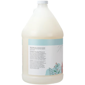 Ginger Lily Farms Botanicals shampoo bottle releases a foamy lather for gentle cleansing.