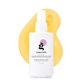 Ginger Milk Thermal Protectant bottle pouring to shield hair from heat.