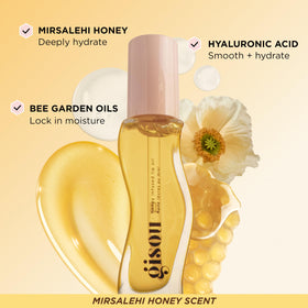 Gisou Honey Gloss Sets hair perfume application spray from arm's length.