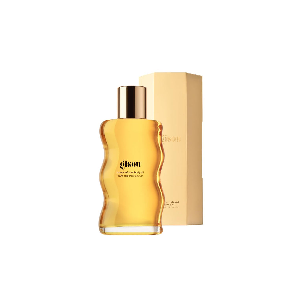 Gisou Honey Infused Body Oil Gold bottle pouring for deep hydration