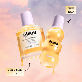 Close-up of the mist bottle showing even dispersion for soft, shiny hair.