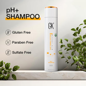 GK HAIR pH+ Clarifying Shampoo with water splash conveying freshness.