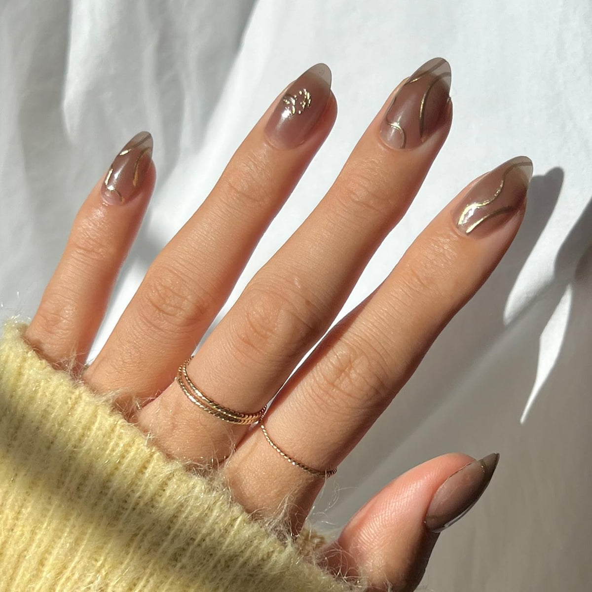 Glamnetic Golden Cup nails set with gold-foil detail for chic, wearable drama.
