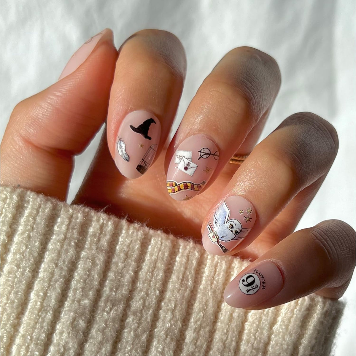Glamnetic Harry Potter Hogwarts semi-transparent nails with magical graphic design