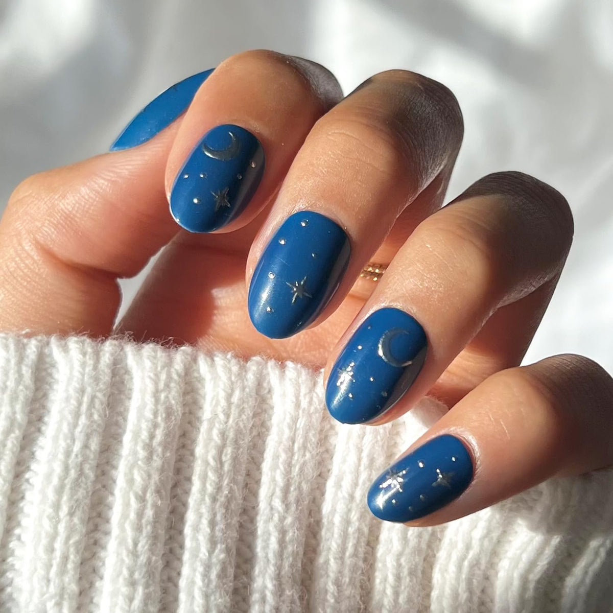 Glamnetic Luna Lovegood nails with blue moon and stars for instant glamour.