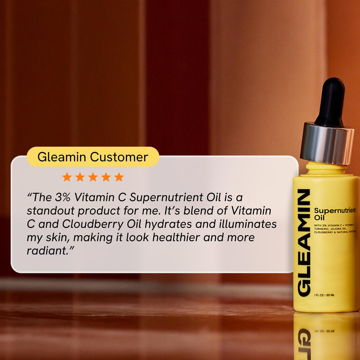 Gleamin Supernutrient Oil bottle and label set communicates vegan, dermatologist-tested credentials.