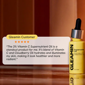 Gleamin Supernutrient Oil bottle and label set communicates vegan, dermatologist-tested credentials.