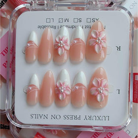 Close-up of three-dimensional floral design on Gleamrain nails.