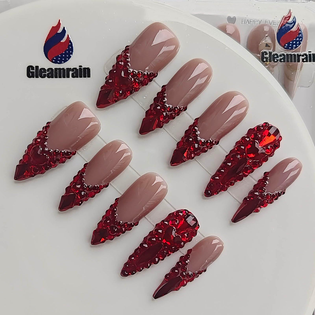 Gleamrain nude-base press-ons with a high-gloss finish for a polished glow.