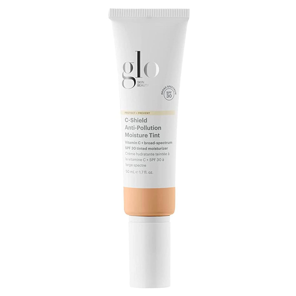 Glo Skin Beauty C-Shield tinted moisturizer bottle with dewy finish and SPF protection.