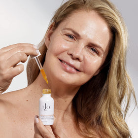 Glo Skin Beauty GlyPro Retinol Drops applying to skin for texture refinement.