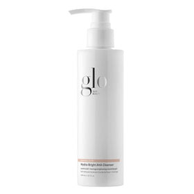 Glo Skin Beauty Hydra-Bright AHA Cleanser bottle showcases hydrating formula for all skin types.