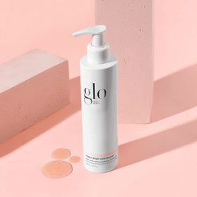 Glo Skin Beauty Hydra-Bright AHA Cleanser highlights moringa seed extract for radiant, balanced skin.