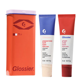 Glossier Balm Dotcom Peppermint Bark 15ml bottle close-up; cooling, hydrating formula for lips.