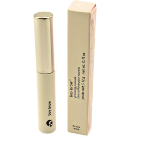 Glossier Boy Brow Black tube close-up shows creamy gel-pomade texture for easy definition.