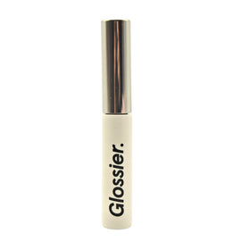 Glossier Boy Brow Clear bottle closeup showing transparent gel for natural definition.
