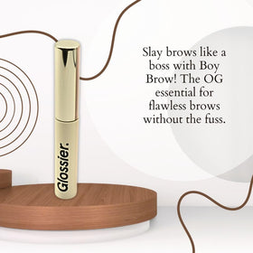 Glossier Boy Brow brush applying gel for soft, flexible brow hold.