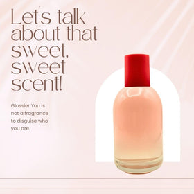Glossier You bottle close-up highlights the thumbprint detail and premium feel.