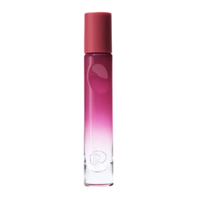 Glossier You Reve perfume bottle close-up highlighting warm ambrox base for near-skin scent.