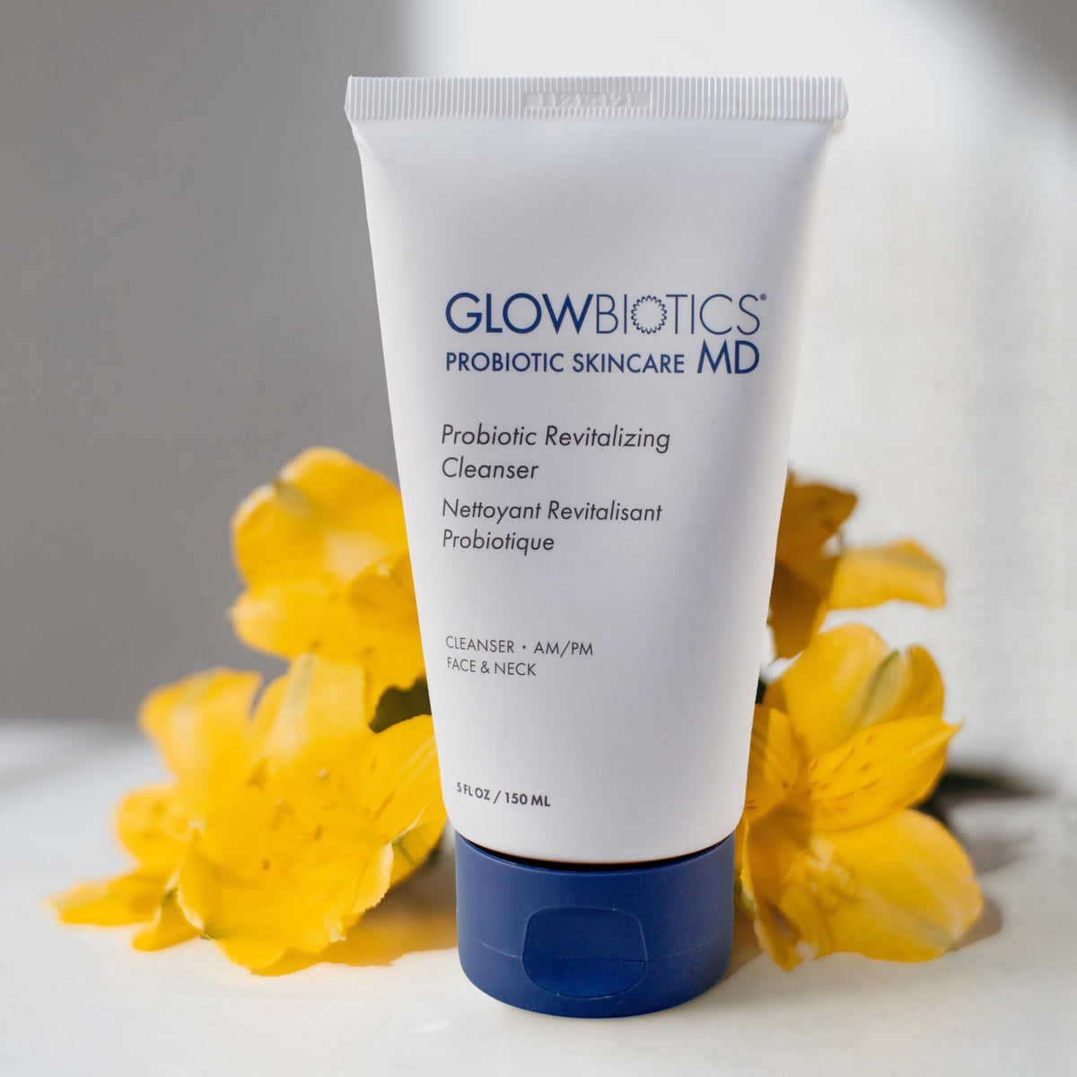 Glowbiotics probiotic revitalizing cleanser in use to soothe redness during routine.