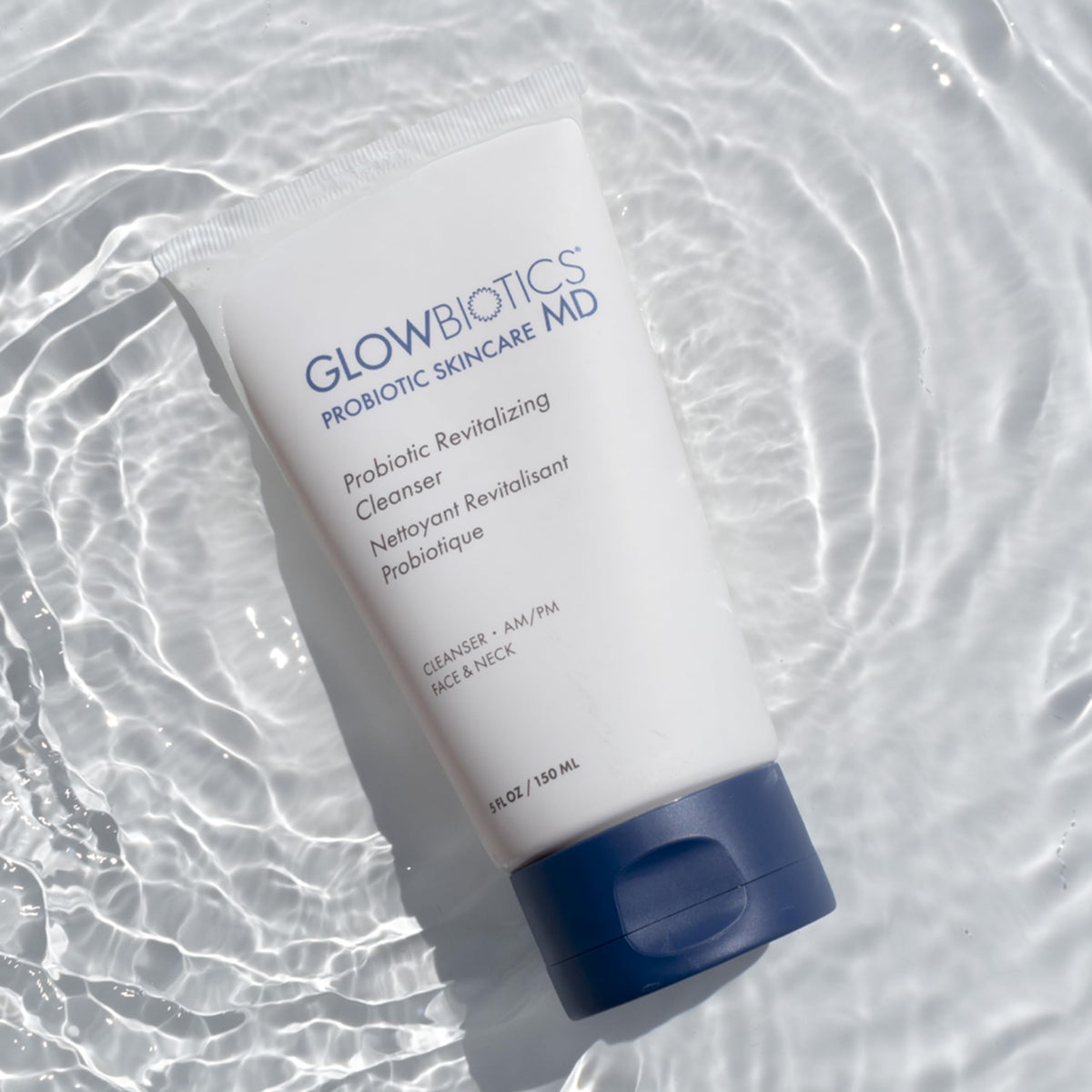 Glowbiotics probiotic revitalizing cleanser texture showing gentle cleansing and dirt removal.