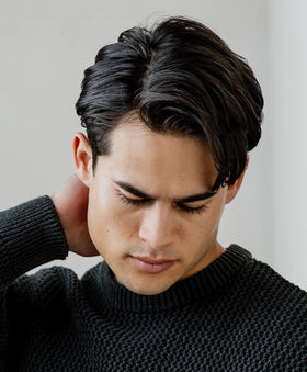 GO247 Grooming Cream hands rubbing together to apply evenly for controlled styling.