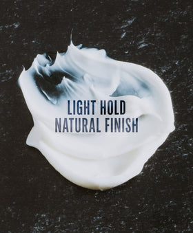 GO247 Grooming Cream applied to wet hair for light hold and added texture.