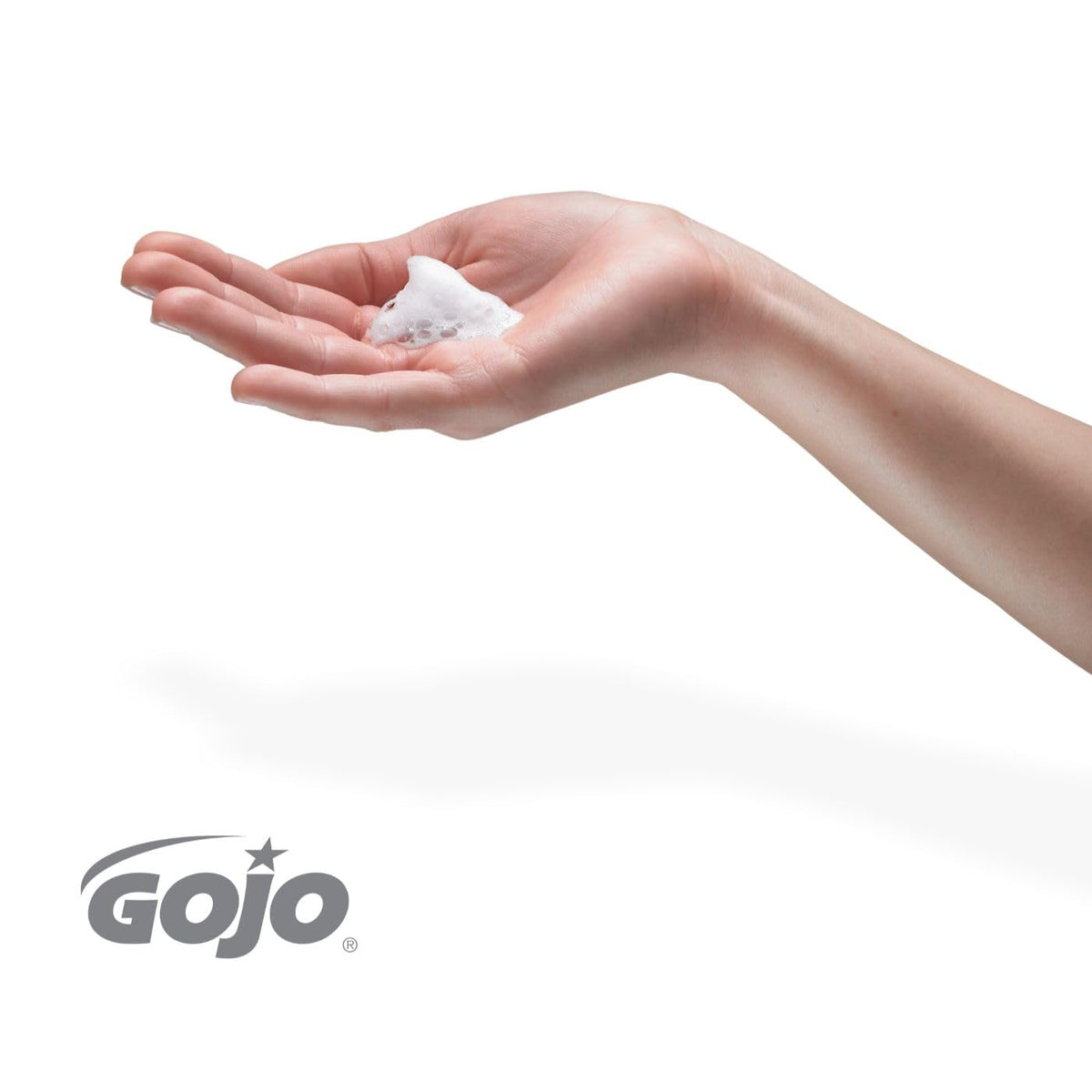 GOJO FMX-12 white dispenser with push-button for ADA-friendly access.