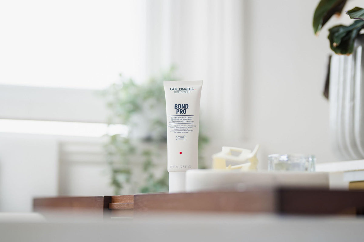 Goldwell Dualsenses Bond Pro Day & Night bottle on counter for weakened hair