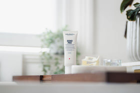 Goldwell Dualsenses Bond Pro Day & Night bottle on counter for weakened hair