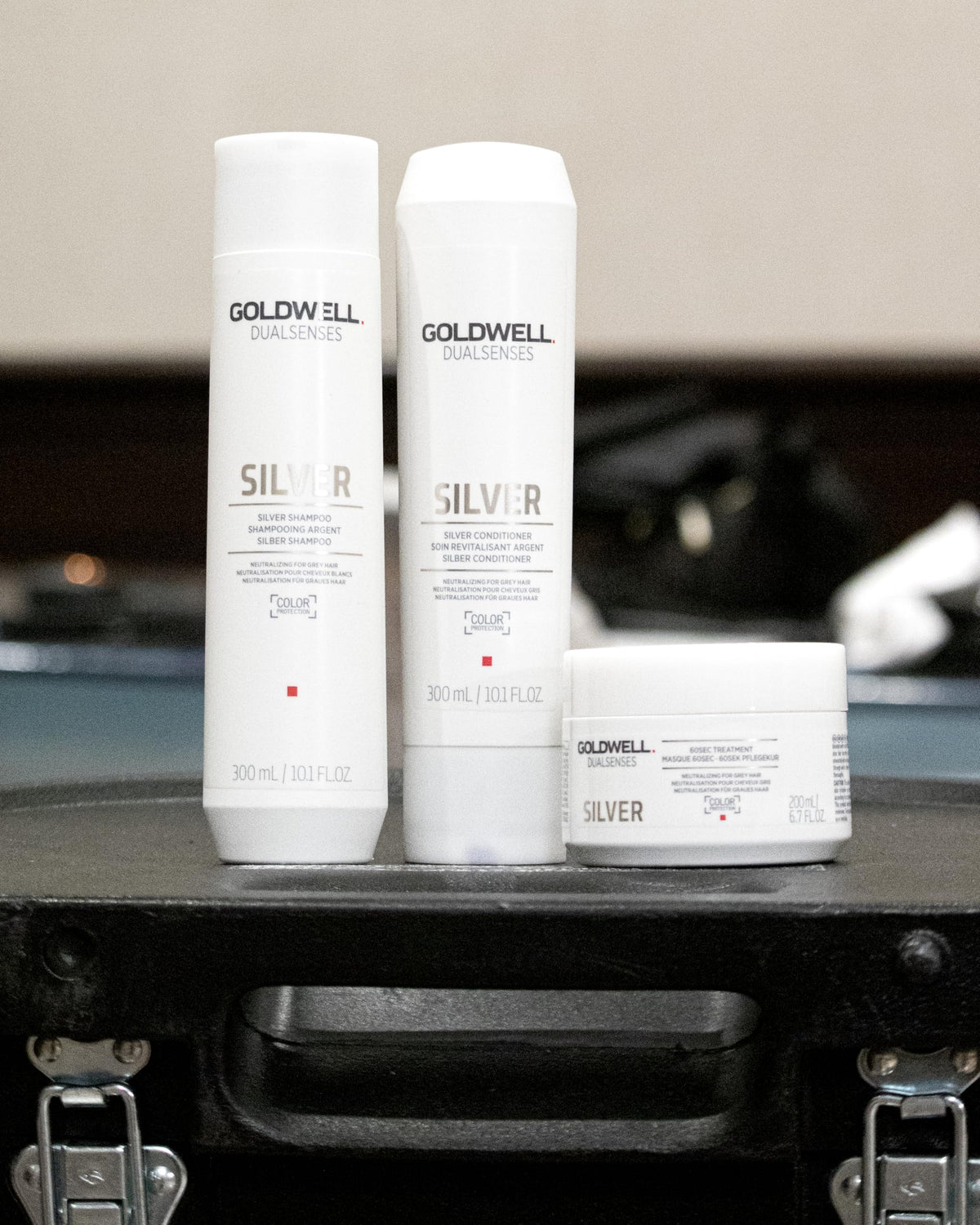 Hands lather Goldwell Dualsenses Silver Shampoo to distribute care evenly