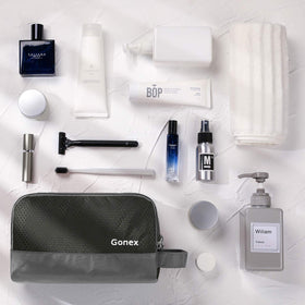 Gonex compact toiletry organizer in gray fits easily in luggage.