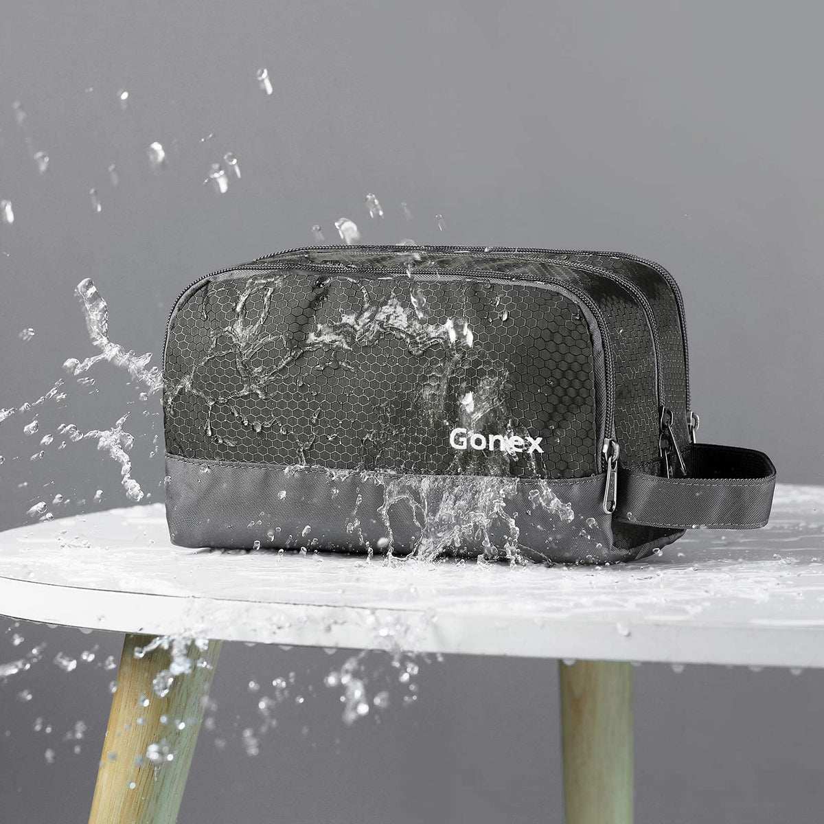 Gonex gray toiletry bag with mesh pocket organizes small items breathably.