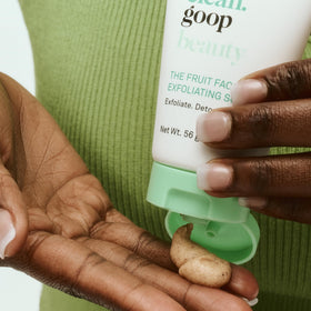 Applying Good Clean Goop Fruit Facial Scrub onto wet skin during cleansing.