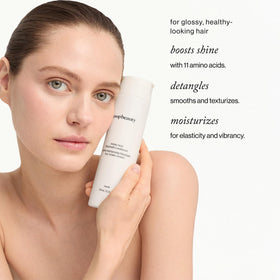 Goop Amino Acid Conditioner pump application for easy detangling.