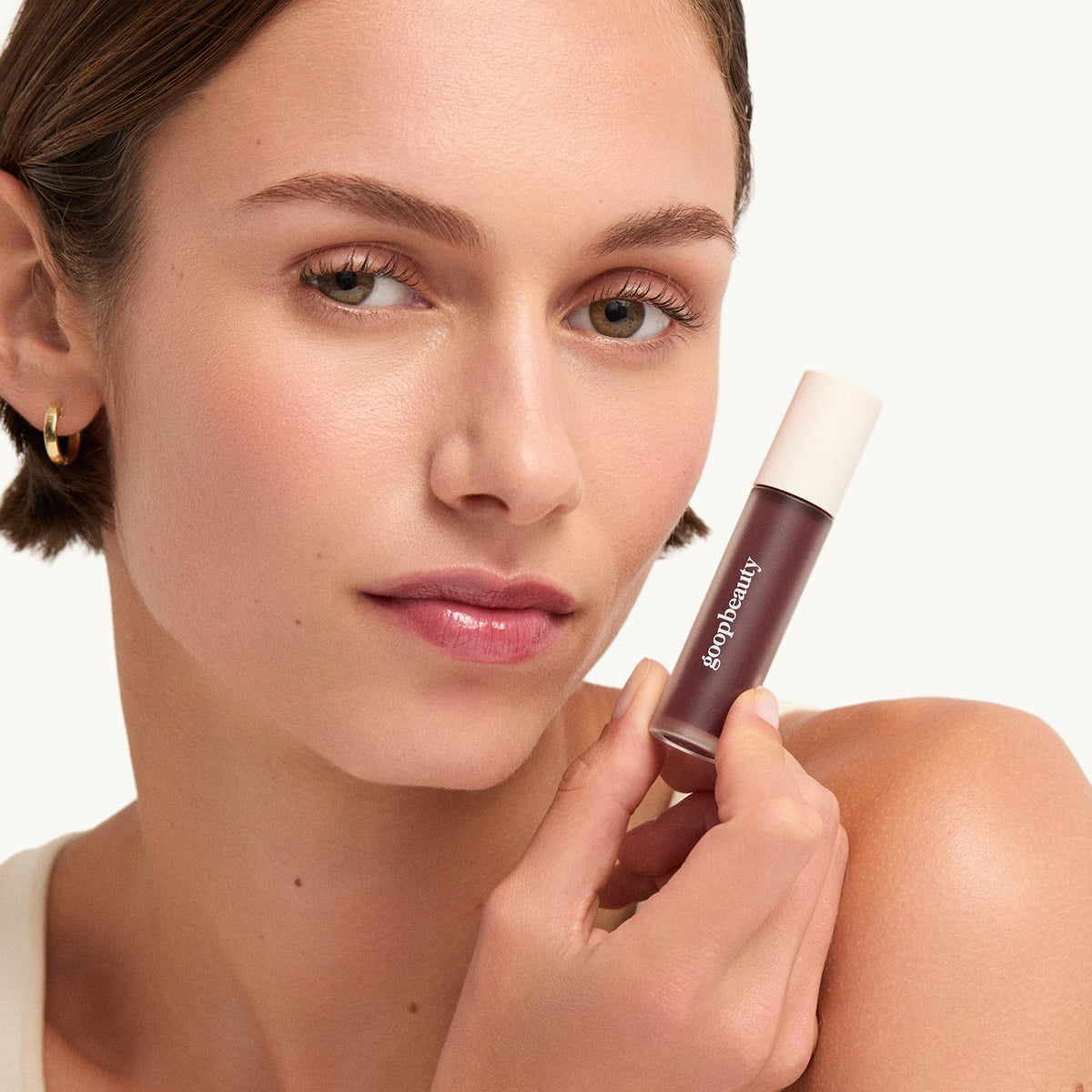 Goop Beauty Hydra-Barrier Gel Gloss packaging label shows shade Glaze and key ingredients