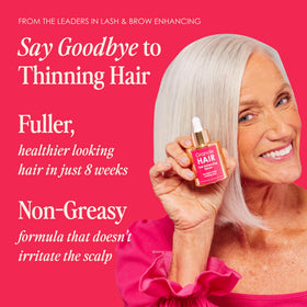 Serum on hand ready for scalp application