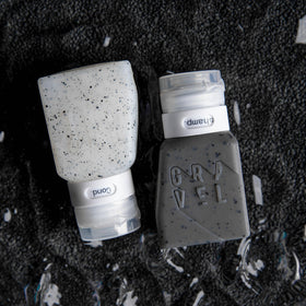 Gravel compact liquid travel containers designed for light packing.