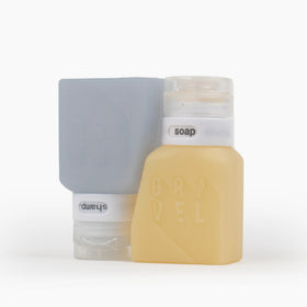 Gravel mini travel containers for carry-on show leak resistance in transit.