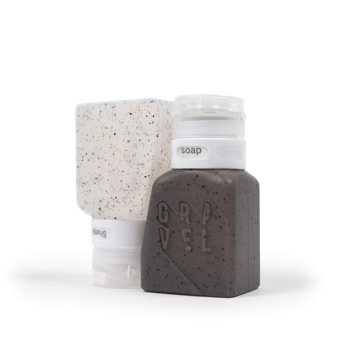 Gravel travel bottles filled with shampoo and conditioner for on-the-go storage.