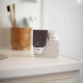 Gravel travel bottles set with clear bag highlighting organized toiletry kit.
