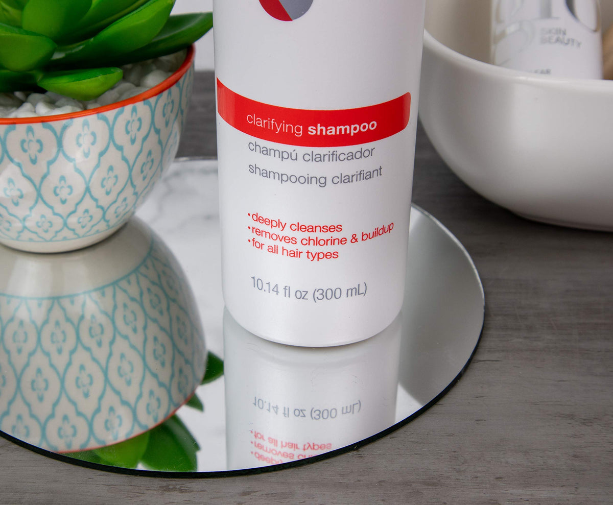 Great Clips Solutions Clarifying Shampoo label close-up highlighting clarifying action.