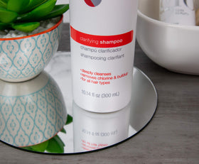 Great Clips Solutions Clarifying Shampoo label close-up highlighting clarifying action.