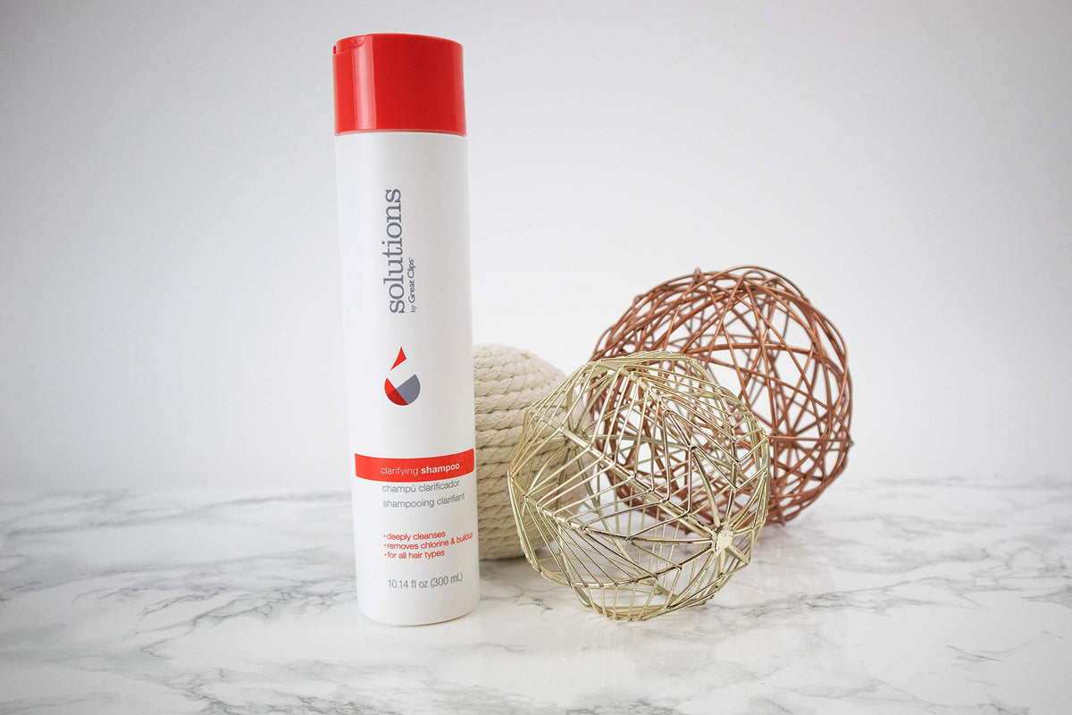 Great Clips Solutions Clarifying Shampoo used after swimming for residue-free hair.